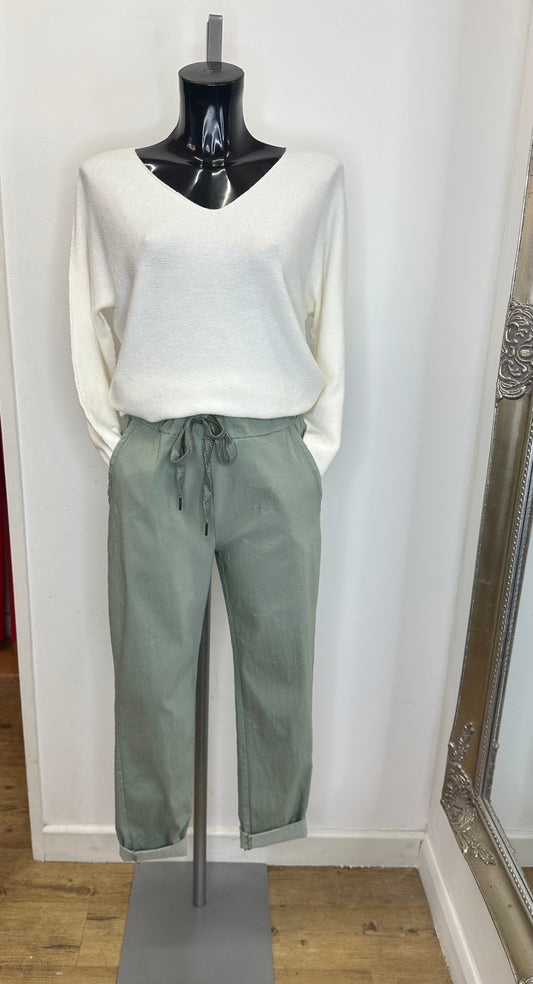 Pale green stretch trousers
